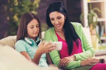 Mom and daughter on safe phone for kids