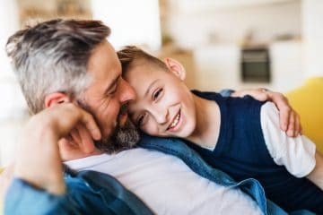Father and son hugging