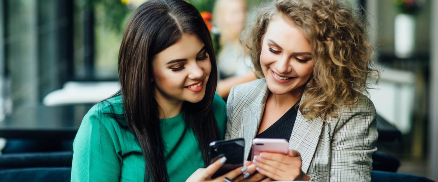 Two happy women on Gabb phones