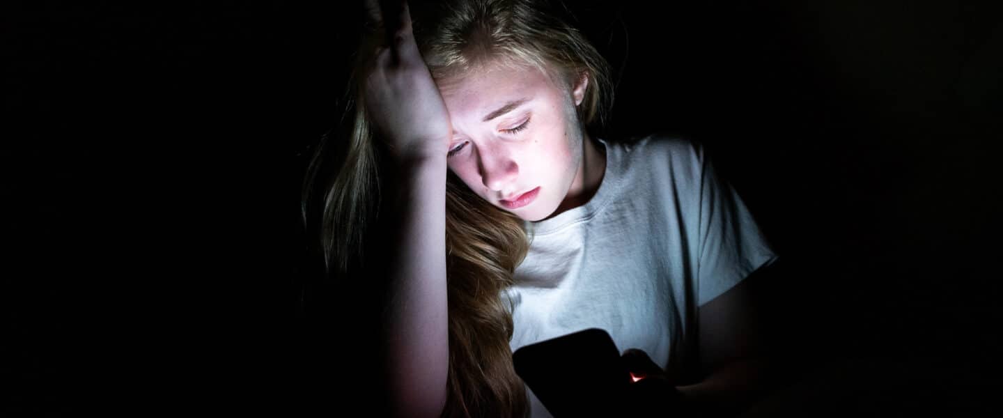 sad girl being groomed online