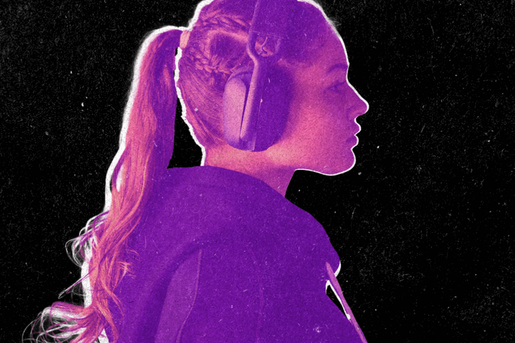 A teenaged girl with headphones on.