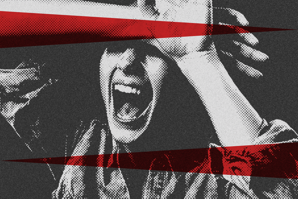 A teenager screaming with her hands up.