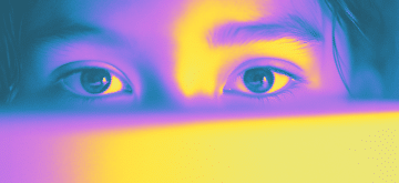 An image of a girl looking at a computer