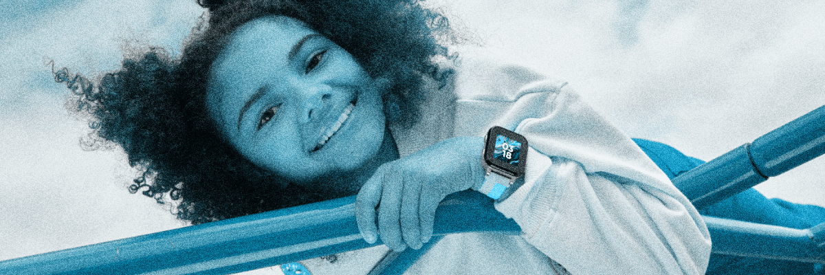 Smiling girl on monkey bars with a Gabb watch