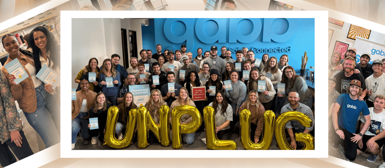 Gabb employees holding balloons that spell "Unplug" to kick off their digital detox.