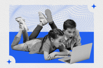 Two kids looking at a computer