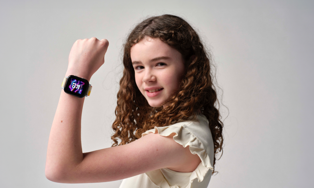 A girl showing off the Gabb Watch