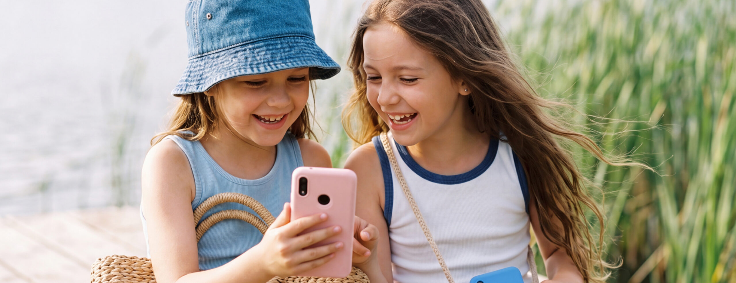 picture of two young girls using a gabb phone