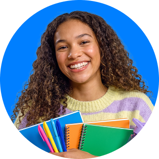 a teen girl smiling while holding her school notebooks