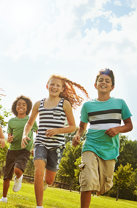 Children running in a field